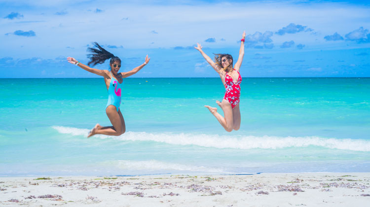 Two girl in jumping female poses 