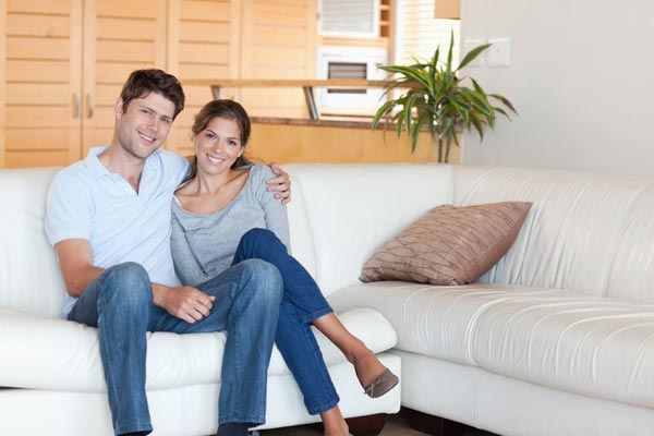 Couple Poses Sitting Together on a Sofa
