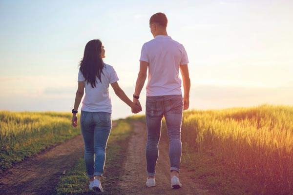 Couple poses Holding hands and Waking Away