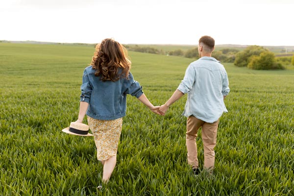 Walking and Holding Hands in Nature Couple Poses