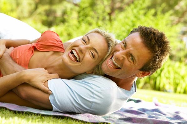 couple Lying on the Ground and Facing towards the Camera Couple poses